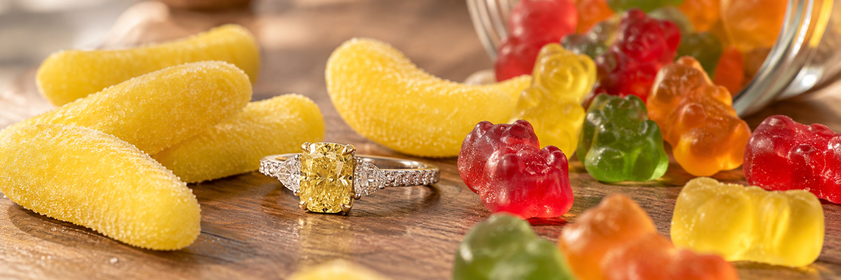 Fancy yellow diamond engagement ring with colorful gummy candy