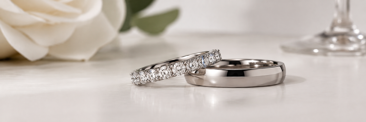 White metal wedding and anniversary rings on a clean light surface