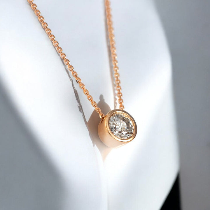 Rose gold bezel set diamond pendant