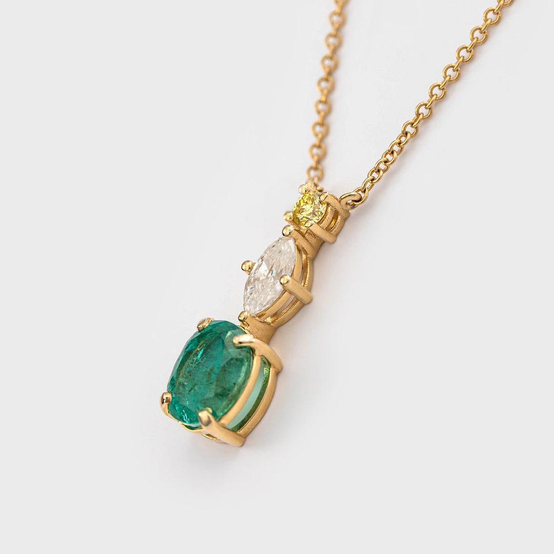 Oval shape Emerald and two Diamonds Pendant