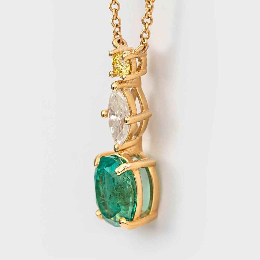 Oval shape Emerald and two Diamonds Pendant
