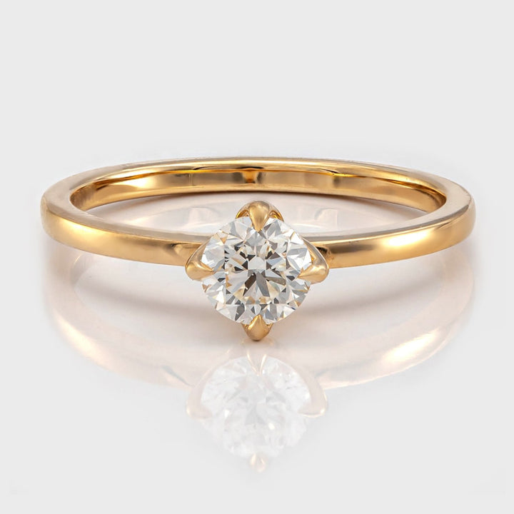 Delicate 4 prongs half carat diamond solitaire