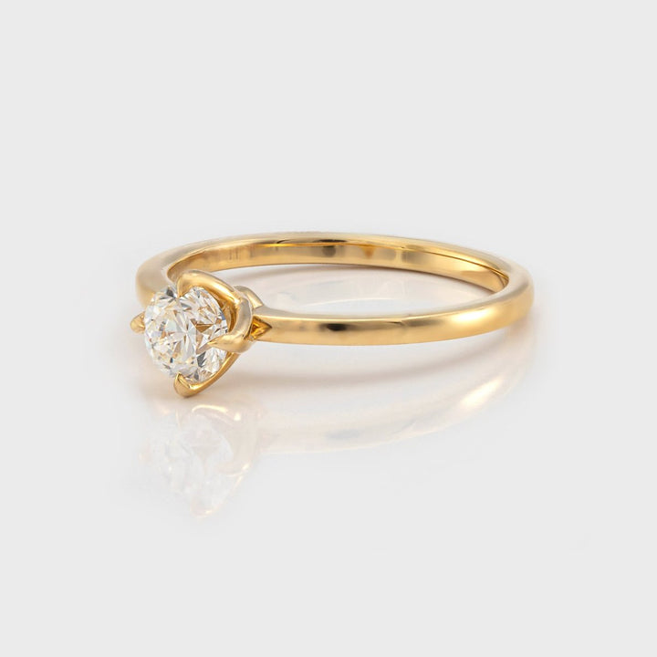 Delicate 4 prongs half carat diamond solitaire