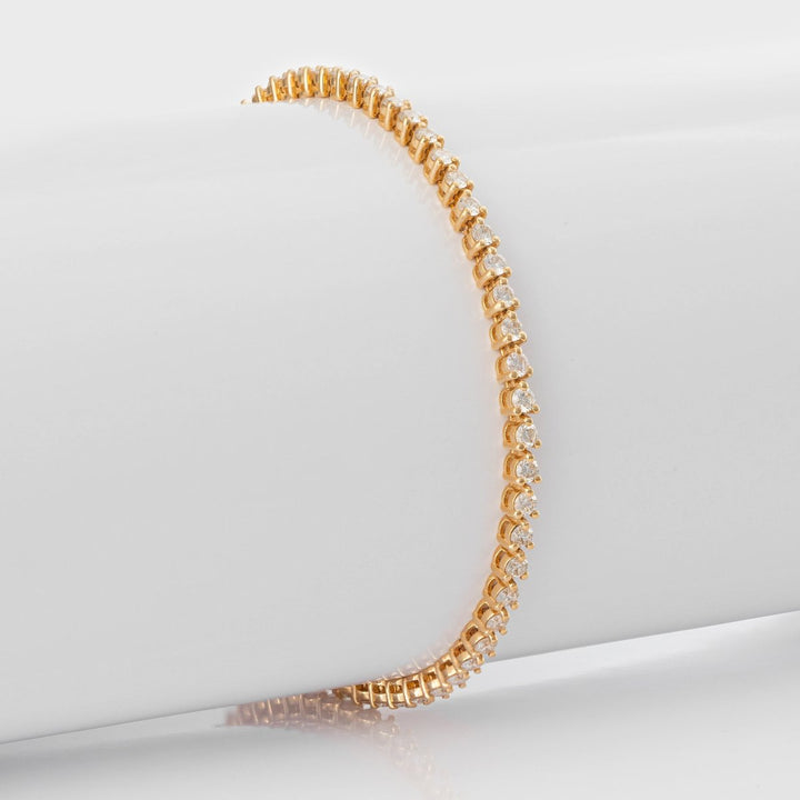 3 prongs yellow gold diamonds tennis bracelet