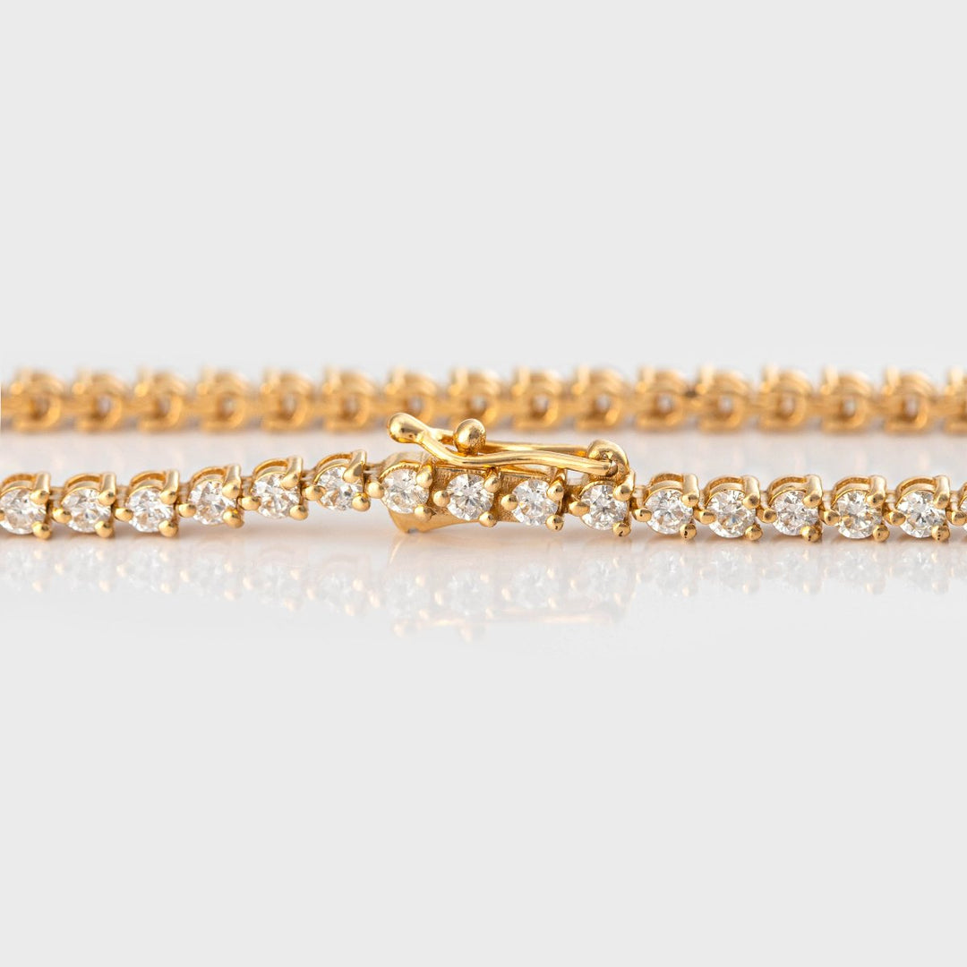 3 prongs yellow gold diamonds tennis bracelet