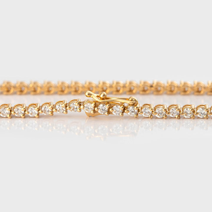 3 prongs yellow gold diamonds tennis bracelet