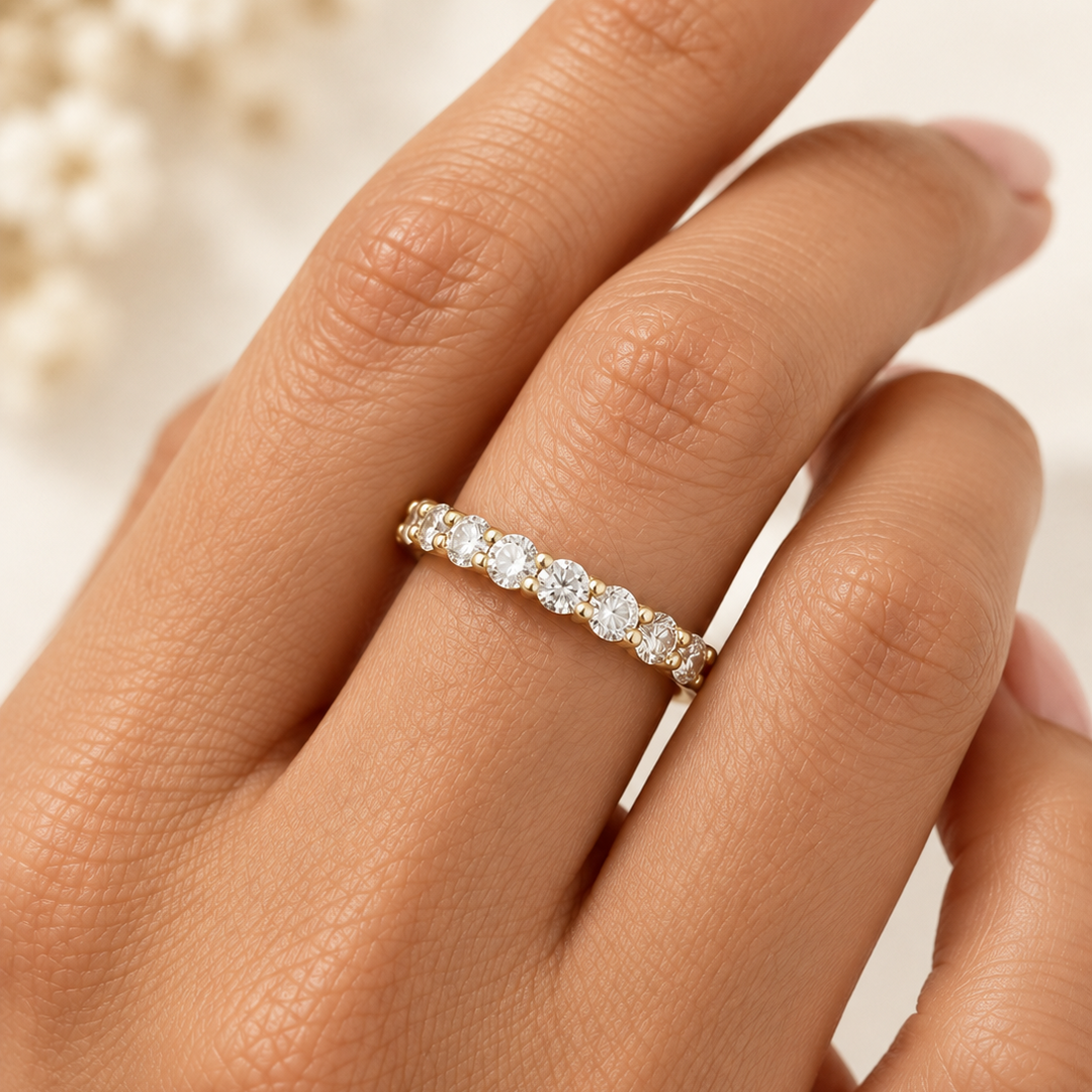 Diamond half eternity ring on finger