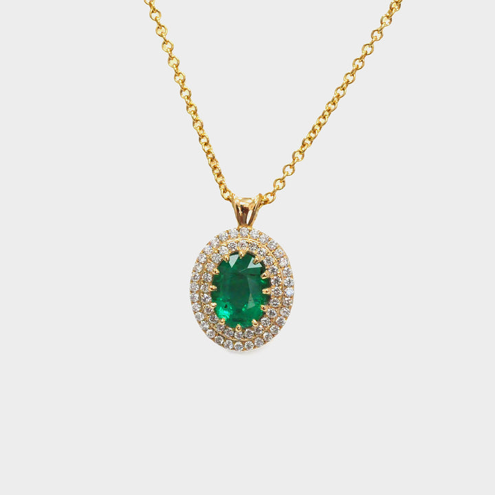 Oval Green Emerald and Diamonds Double Halo Pendant