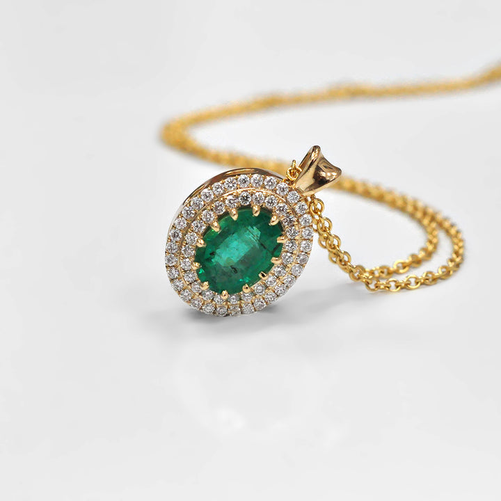 Oval Green Emerald and Diamonds Double Halo Pendant