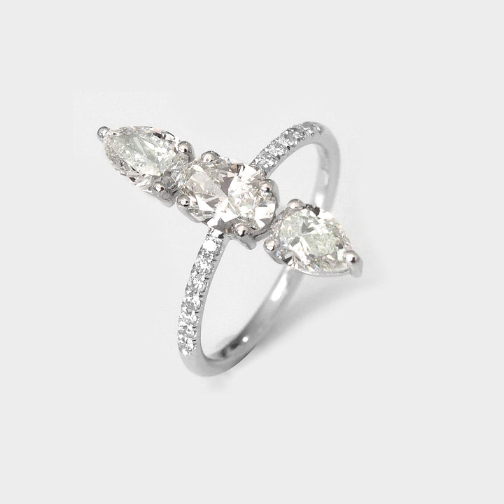 Three Stones Pear and Oval White Diamonds Ring
