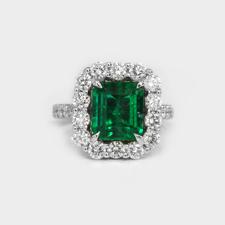 Green Emerald (3 carat) and White Diamonds Halo Ring