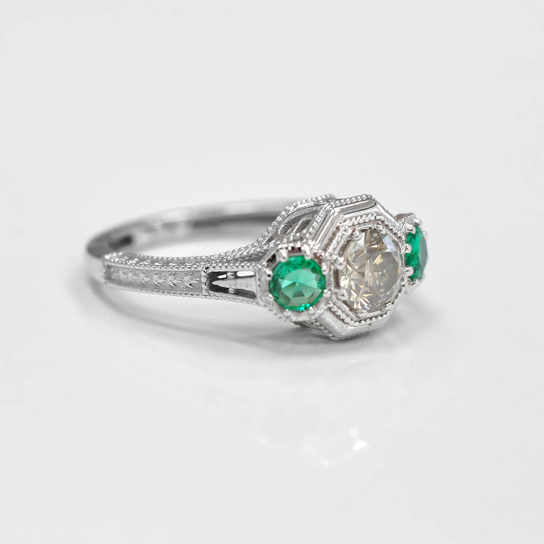 Round Diamond and Pair of Green Emeralds Ring in White Gold