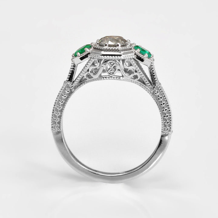 Round Diamond and Pair of Green Emeralds Ring in White Gold