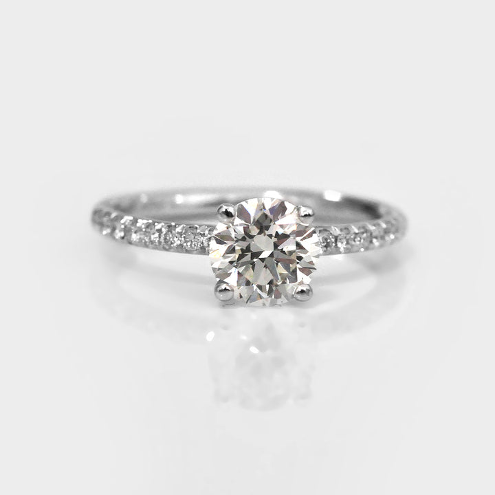 White Round Diamond Classic Martini Ring withSide Diamonds.
