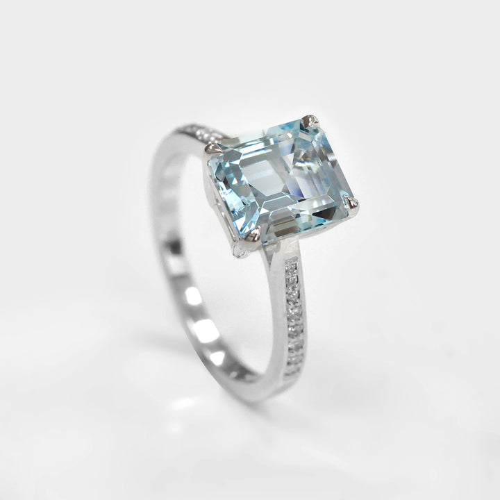 Light Blue Aquamarine and Side Diamonds Ring
