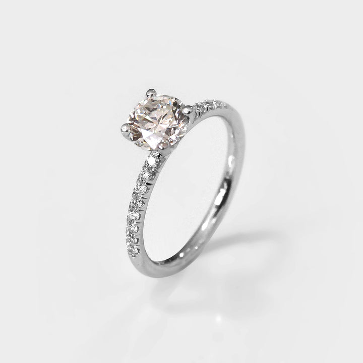 White Round Diamond Classic Martini Ring withSide Diamonds.