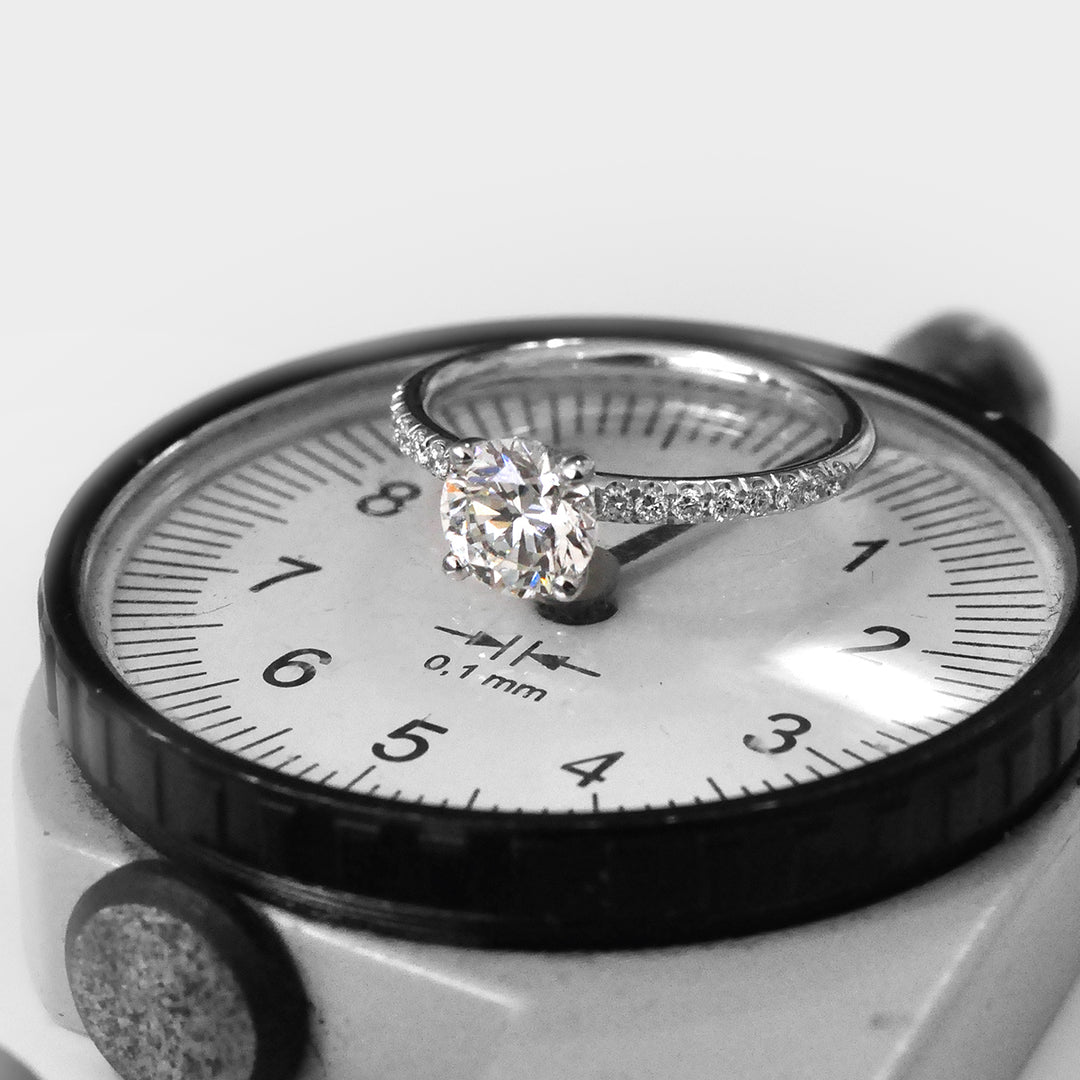 White Round Diamond Classic Martini Ring withSide Diamonds.