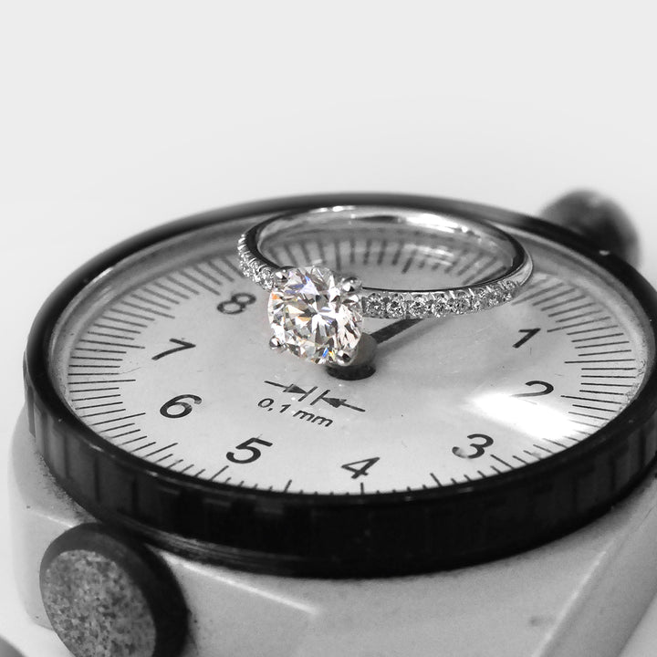 White Round Diamond Classic Martini Ring withSide Diamonds.