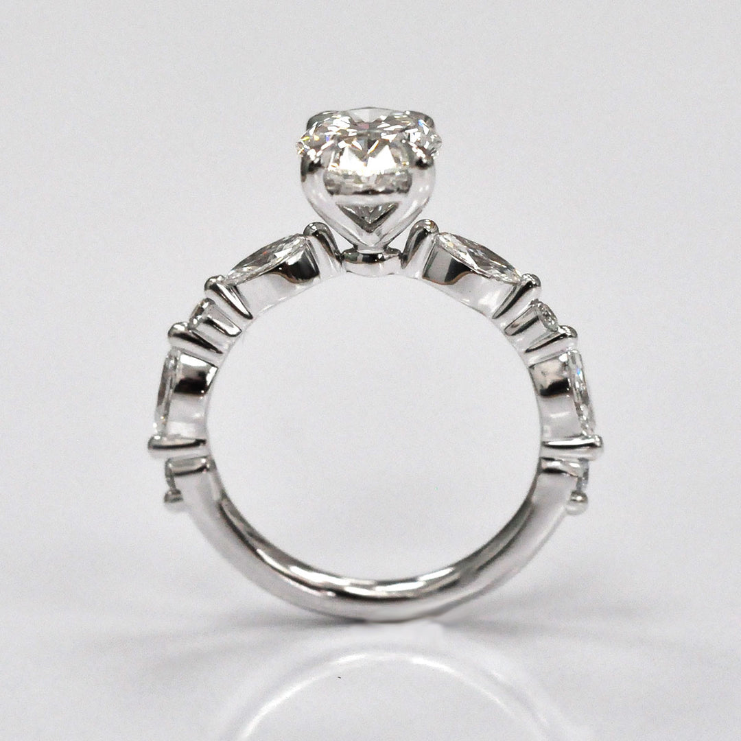 Oval Center Diamond with marquise &amp; Round side diamonds ring
