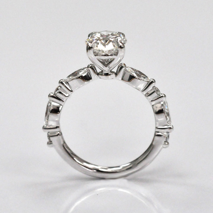 Oval Center Diamond with marquise &amp; Round side diamonds ring