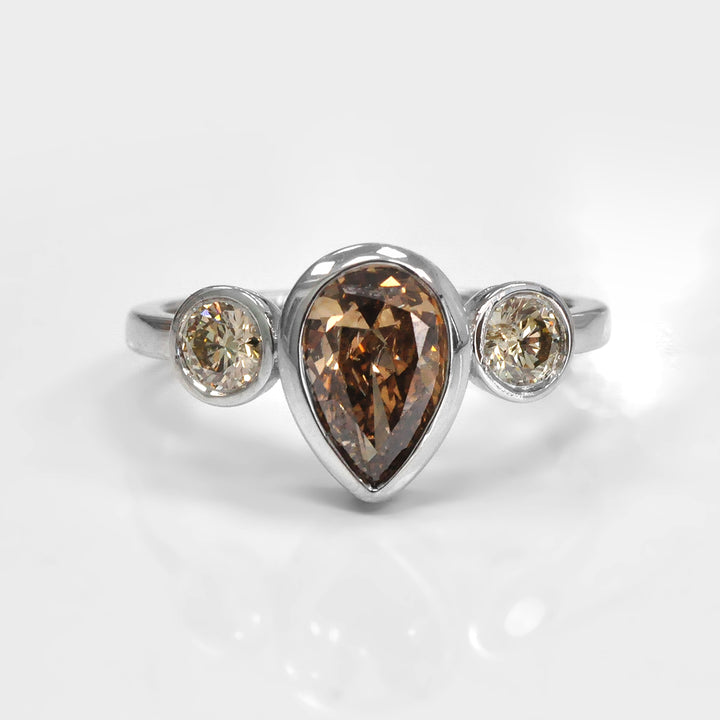 Pear Shape and Two Round cut brown diamonds ring