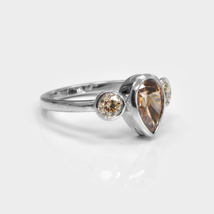 Pear Shape and Two Round cut brown diamonds ring