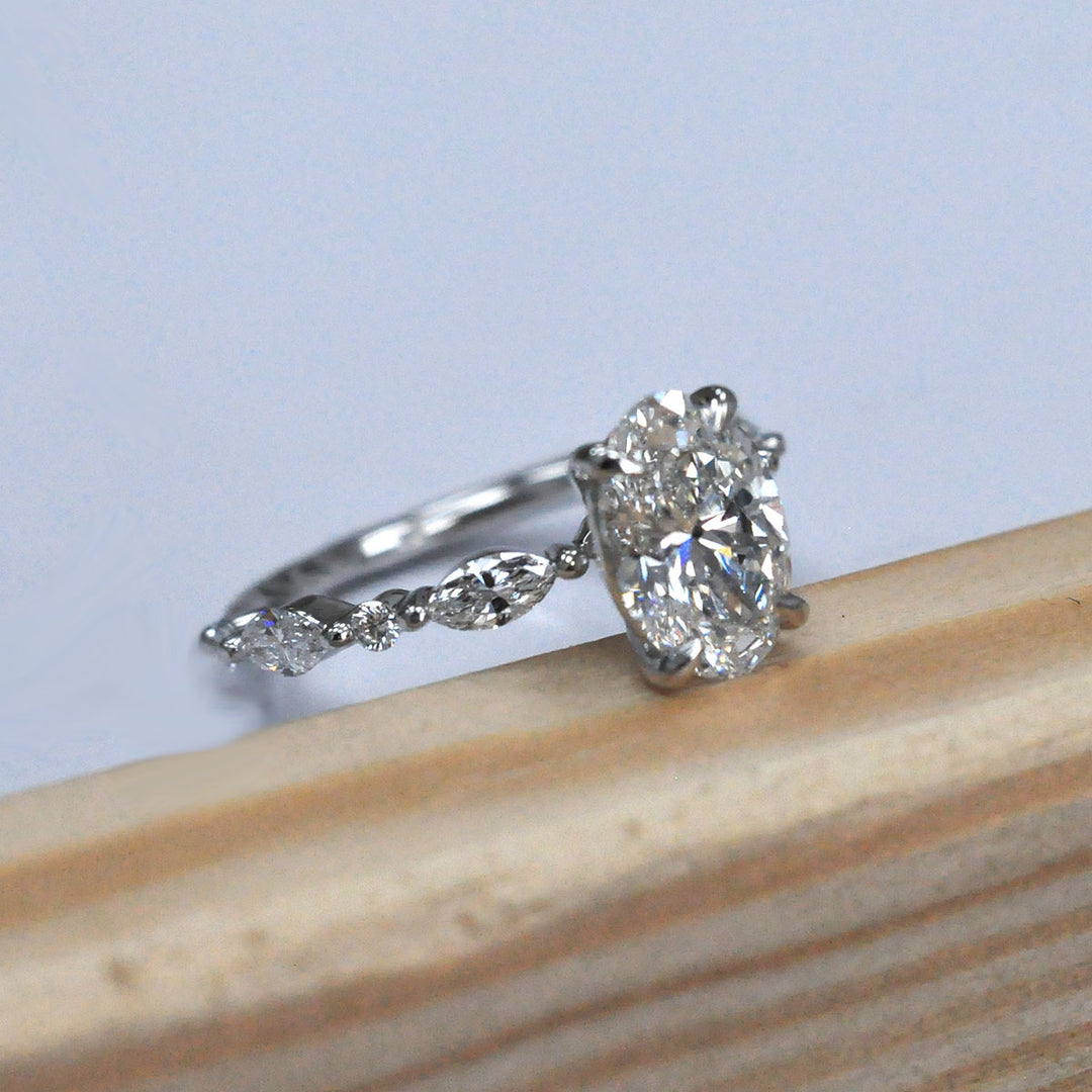 Oval Center Diamond with marquise &amp; Round side diamonds ring