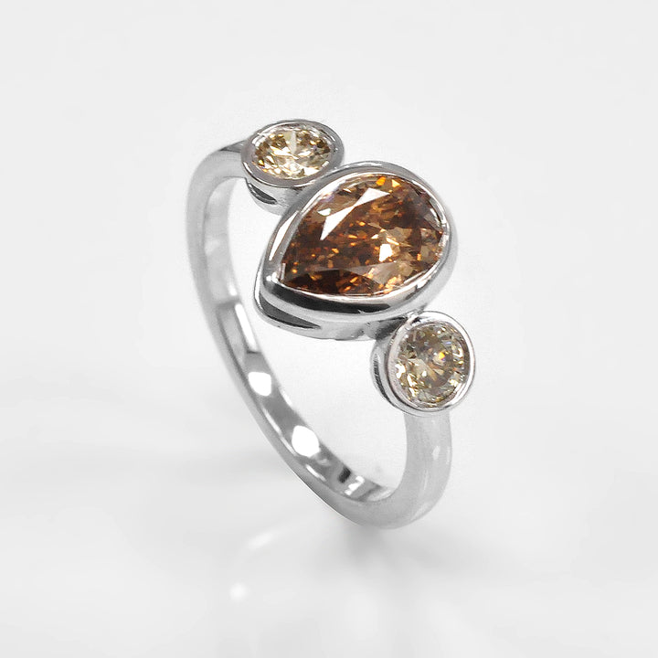 Pear Shape and Two Round cut brown diamonds ring