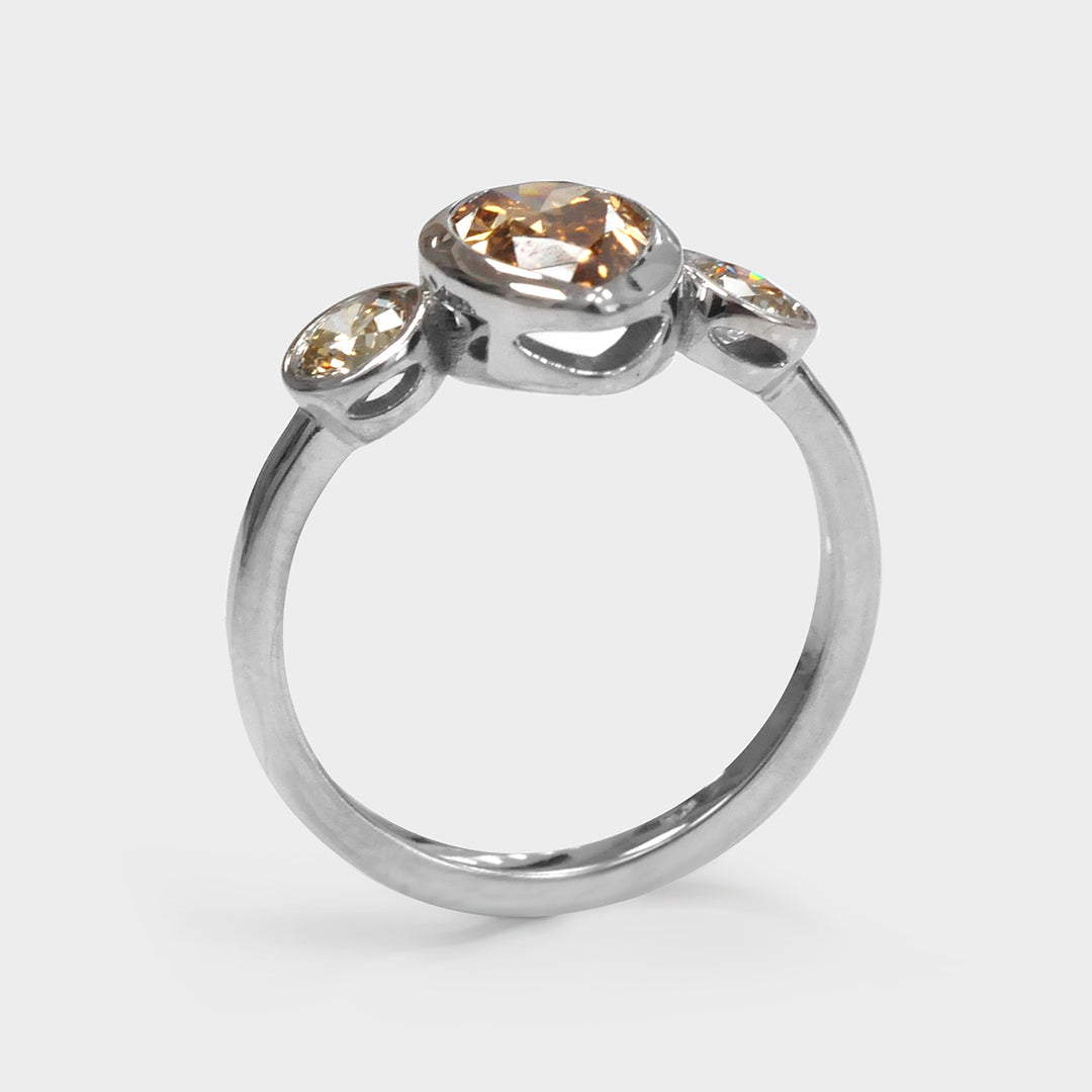 Pear Shape and Two Round cut brown diamonds ring