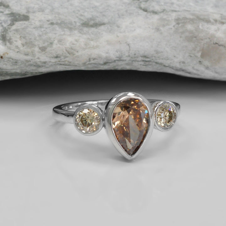 Pear Shape and Two Round cut brown diamonds ring