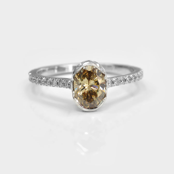Oval Yellowish Brown half Bezel Setting Diamonds Ring