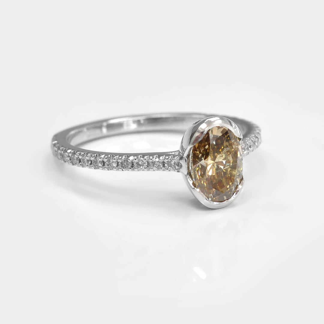 Oval Yellowish Brown half Bezel Setting Diamonds Ring