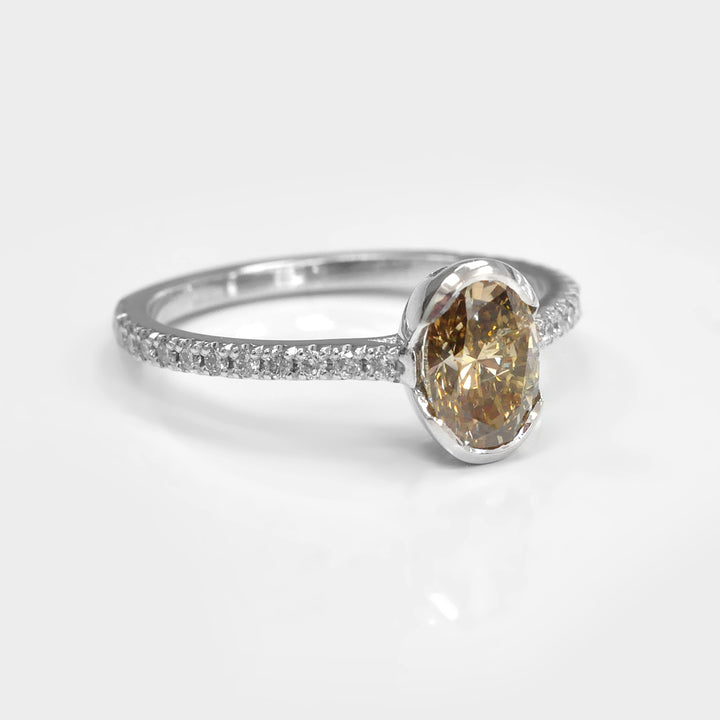 Oval Yellowish Brown half Bezel Setting Diamonds Ring