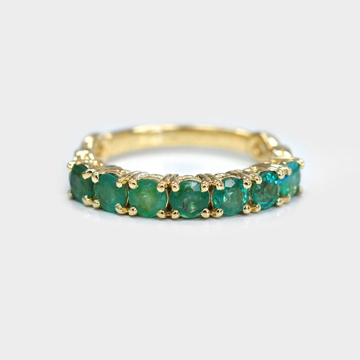Seven Round Emeralds Ring in Yellow Gold