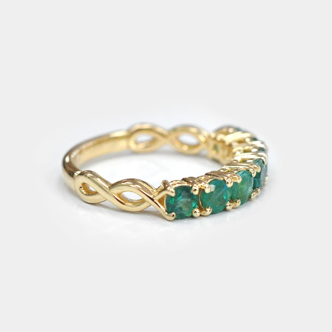 Seven Round Emeralds Ring in Yellow Gold