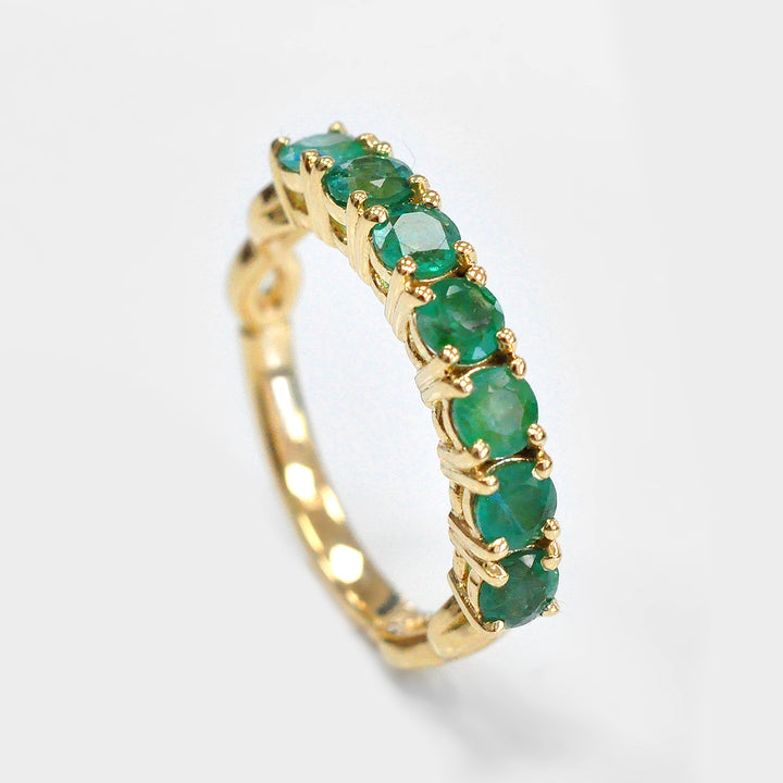 Seven Round Emeralds Ring in Yellow Gold