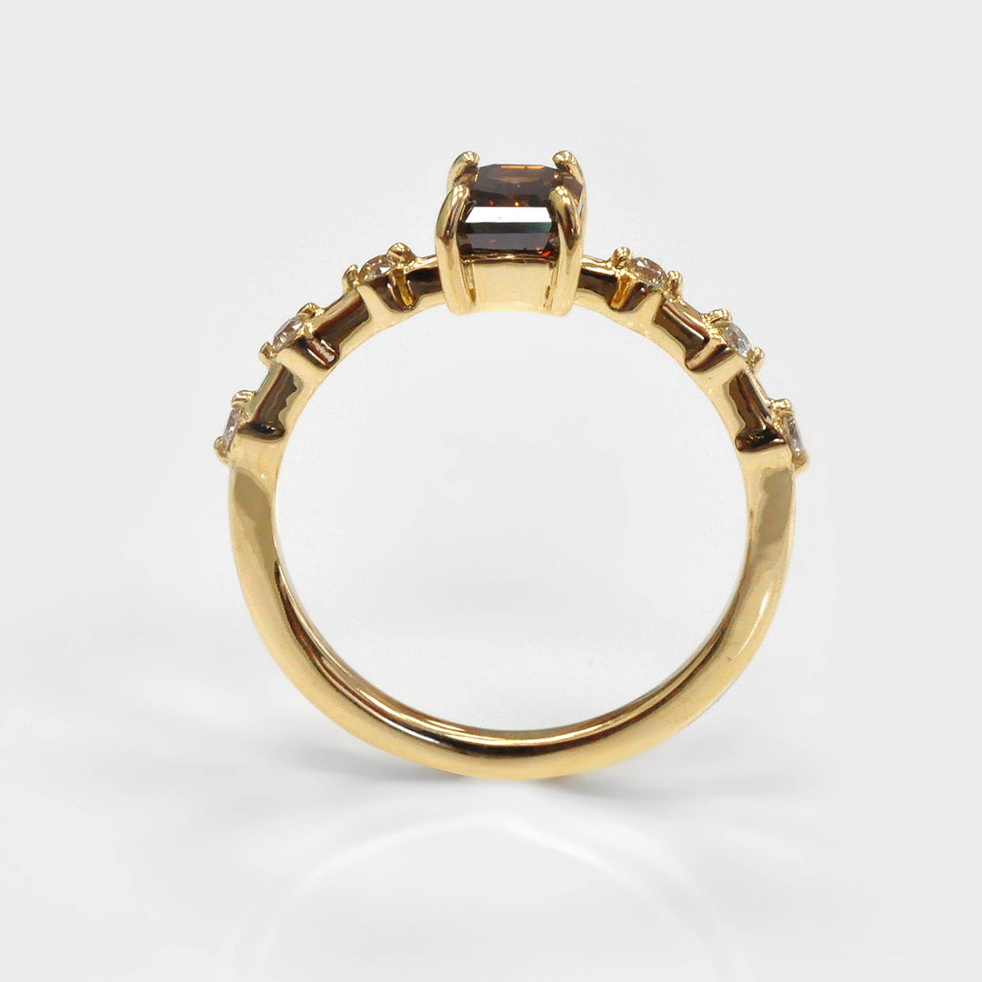 Delicate Emerald cut Diamond and 6 Side Diamonds Ring