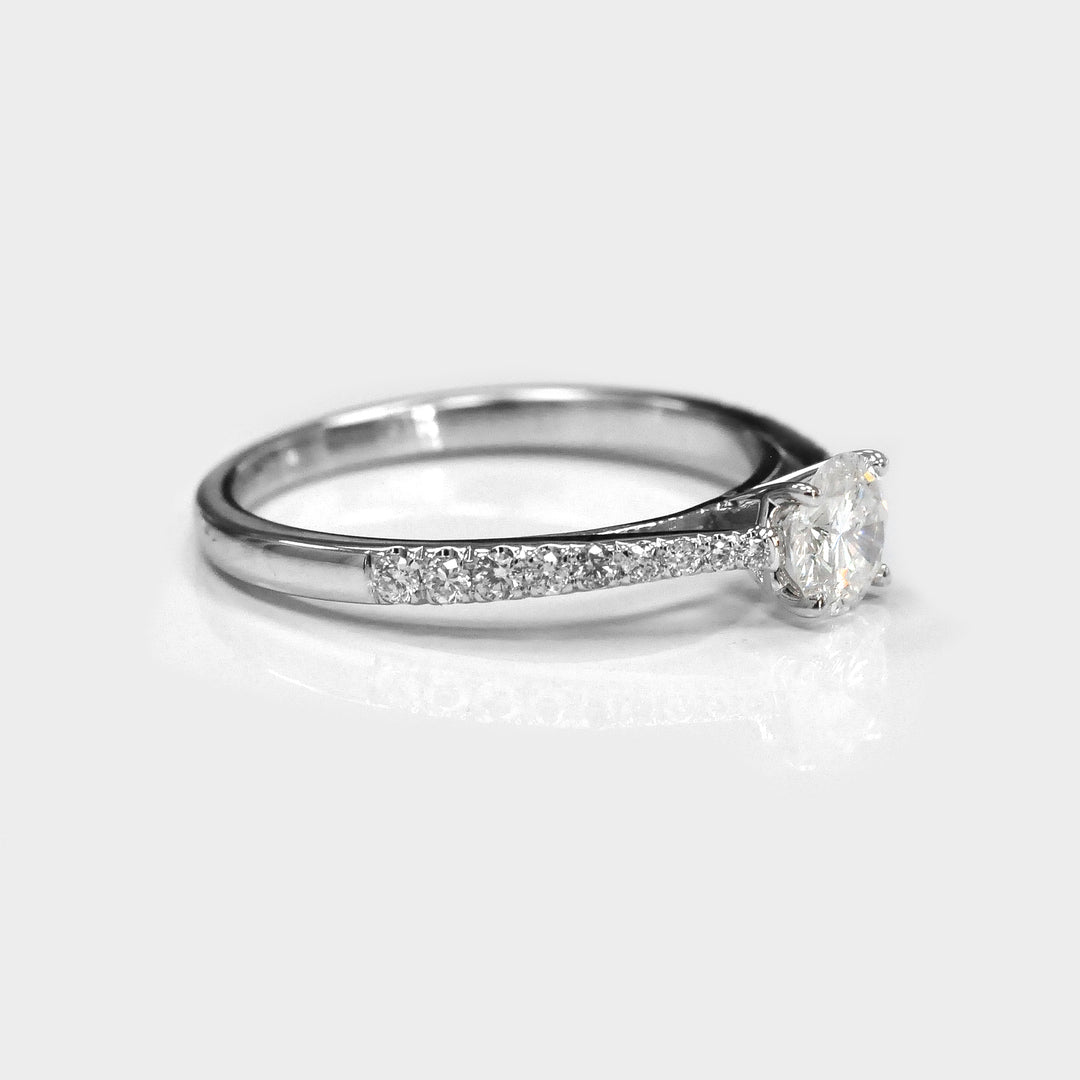 classic side stones elevated shank engagement ring