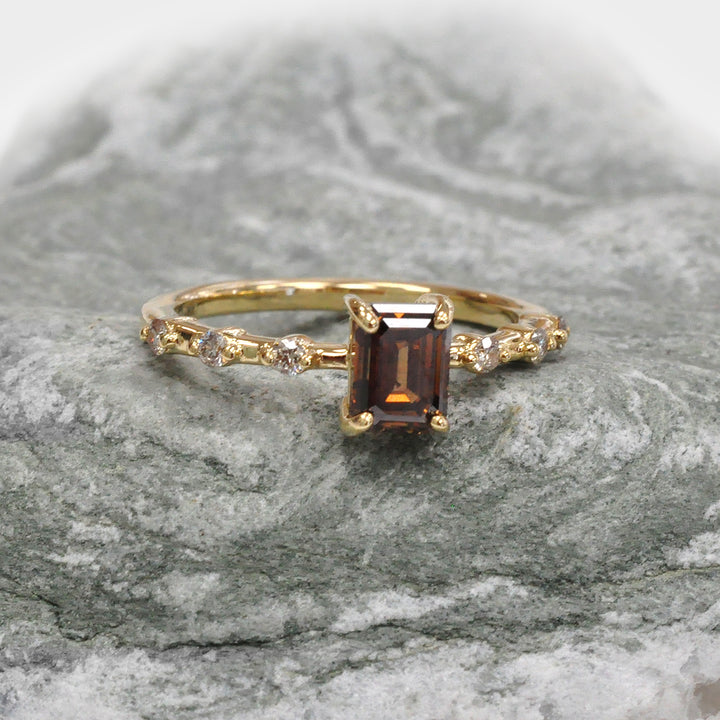 Delicate Emerald cut Diamond and 6 Side Diamonds Ring