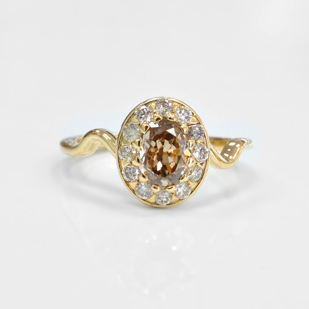Oval Diamond and Halo twisted shank yellow gold Ring
