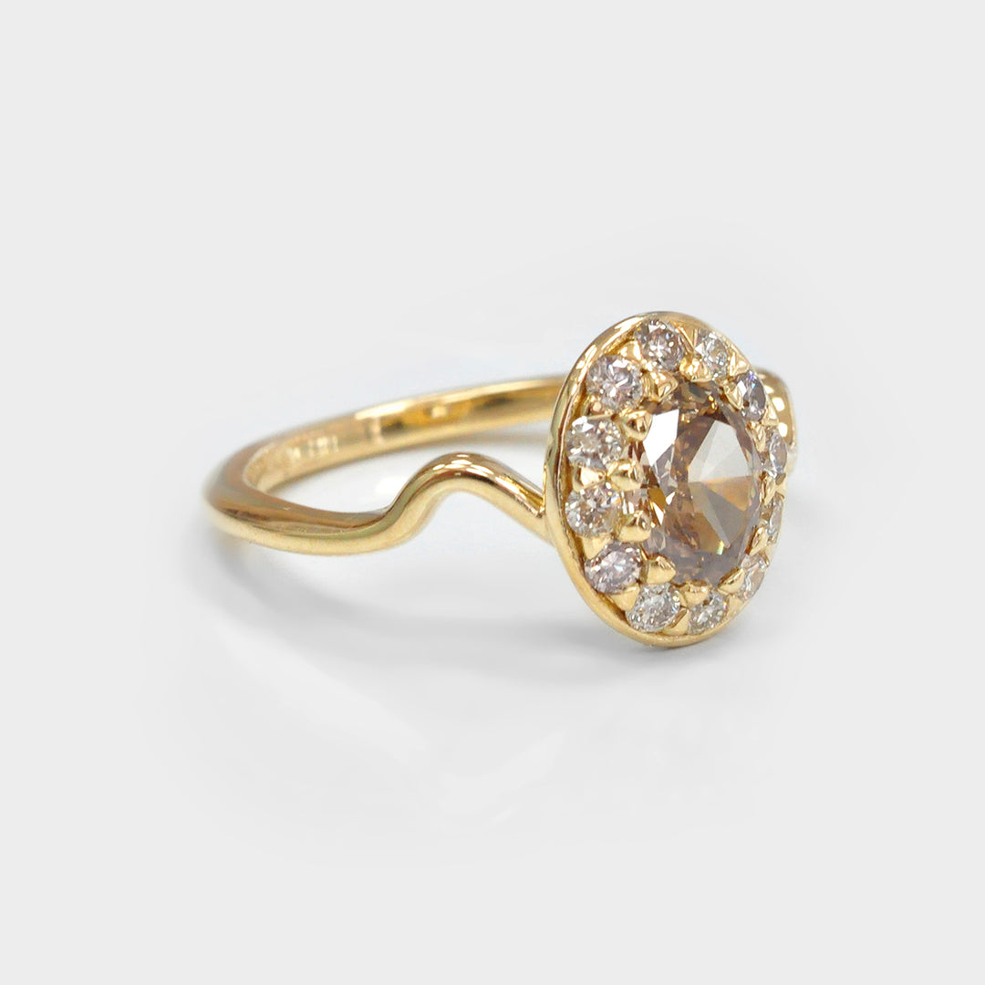 Oval Diamond and Halo twisted shank yellow gold Ring