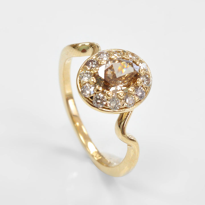 Oval Diamond and Halo twisted shank yellow gold Ring