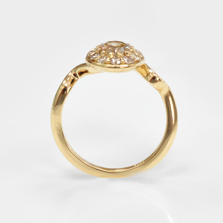 Oval Diamond and Halo twisted shank yellow gold Ring