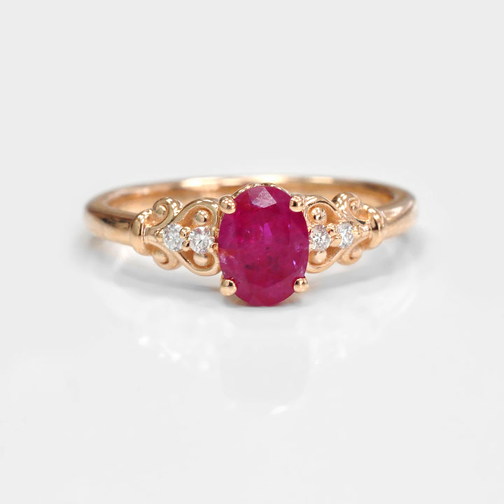 Oval Cut Ruby and Four Side Diamonds Ring