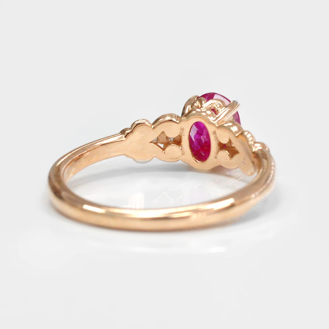 Oval Cut Ruby and Four Side Diamonds Ring