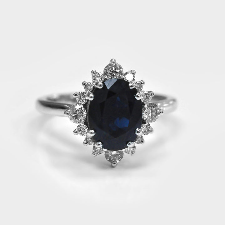 Oval Cut Deep Blue Sapphire and white Diamonds Ring