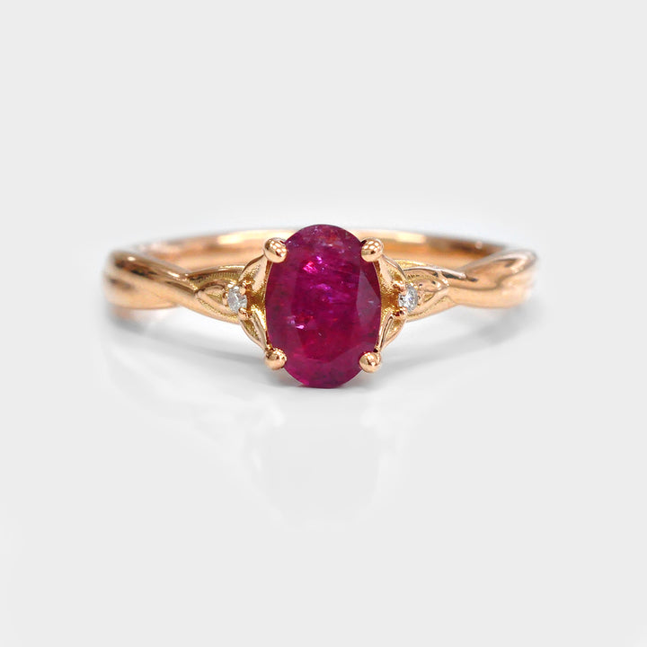 18K gold Oval Ruby and Two Side Diamonds Ring