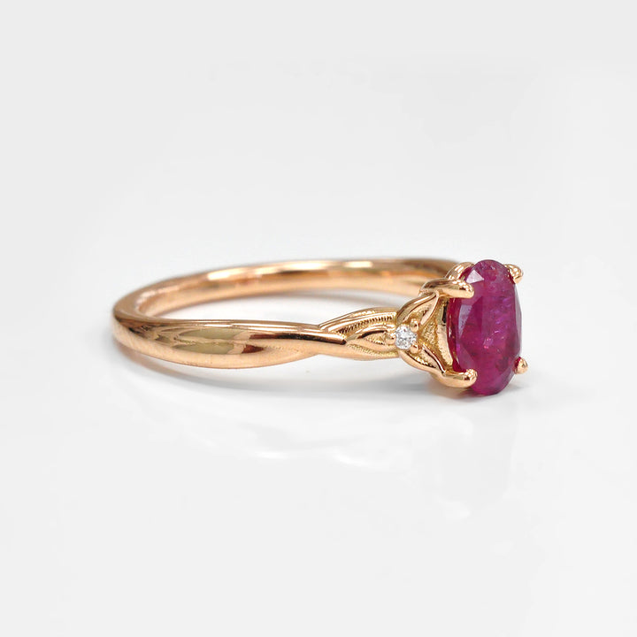 18K gold Oval Ruby and Two Side Diamonds Ring