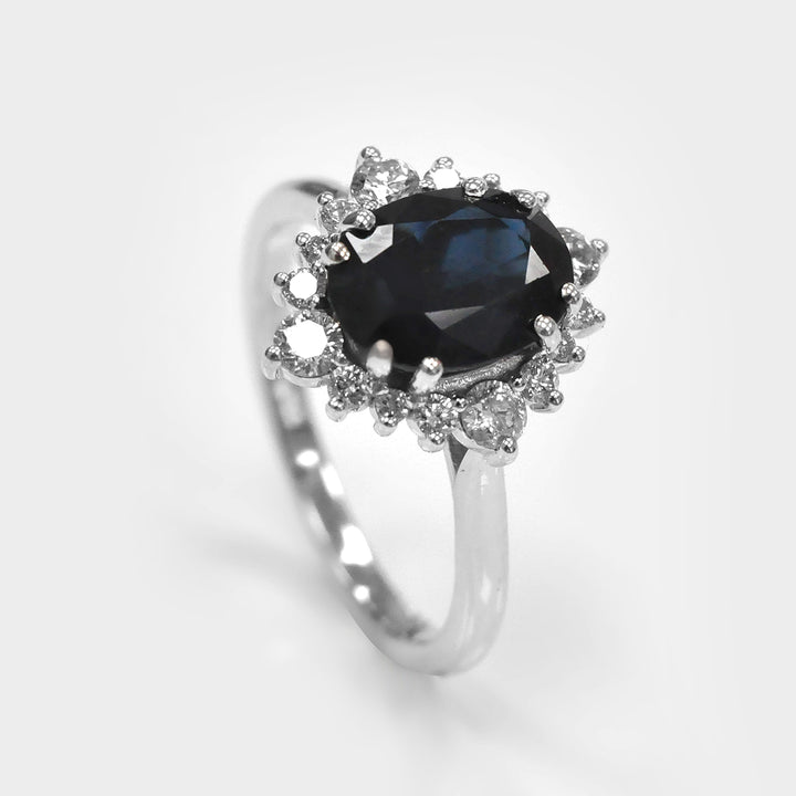 Oval Cut Deep Blue Sapphire and white Diamonds Ring