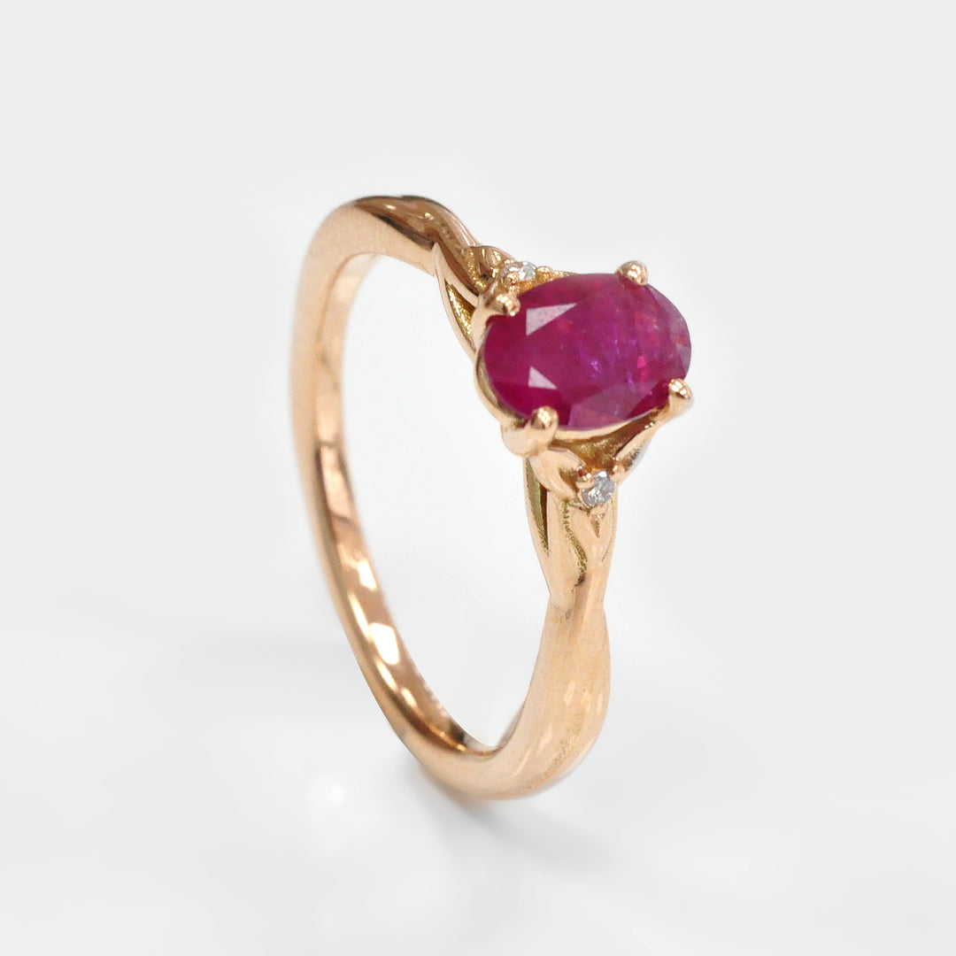 18K gold Oval Ruby and Two Side Diamonds Ring